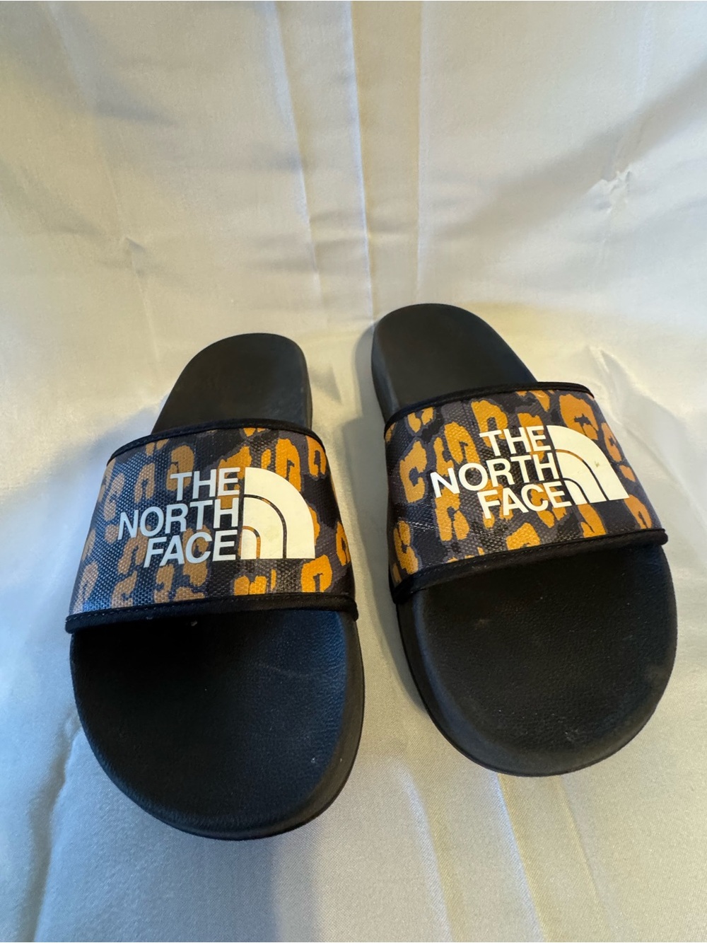 The North Face Black Slides with Orange Leopard Strap